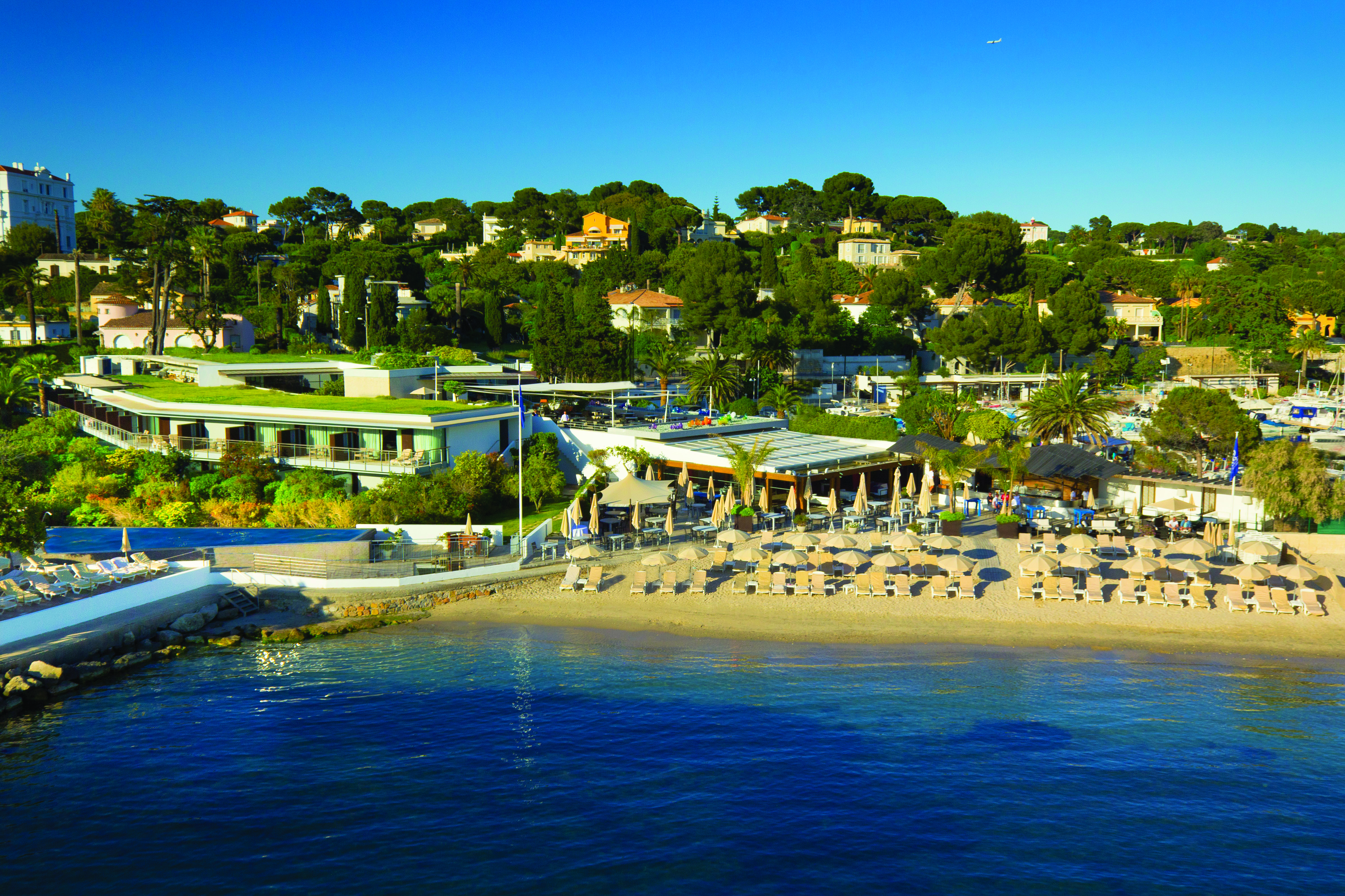 Le Cap d'Antibes Beach Hotel Cote d'Azur beach aerial view sun loungers and umbrellas