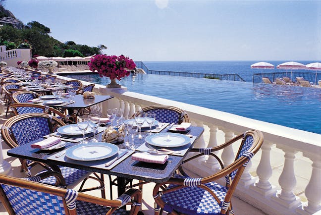 Grand Hotel du Cap Ferrat Cote d'Azur terrace dining area sea and pool view