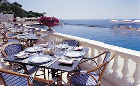 Grand Hotel du Cap Ferrat Cote d'Azur terrace dining area sea and pool view