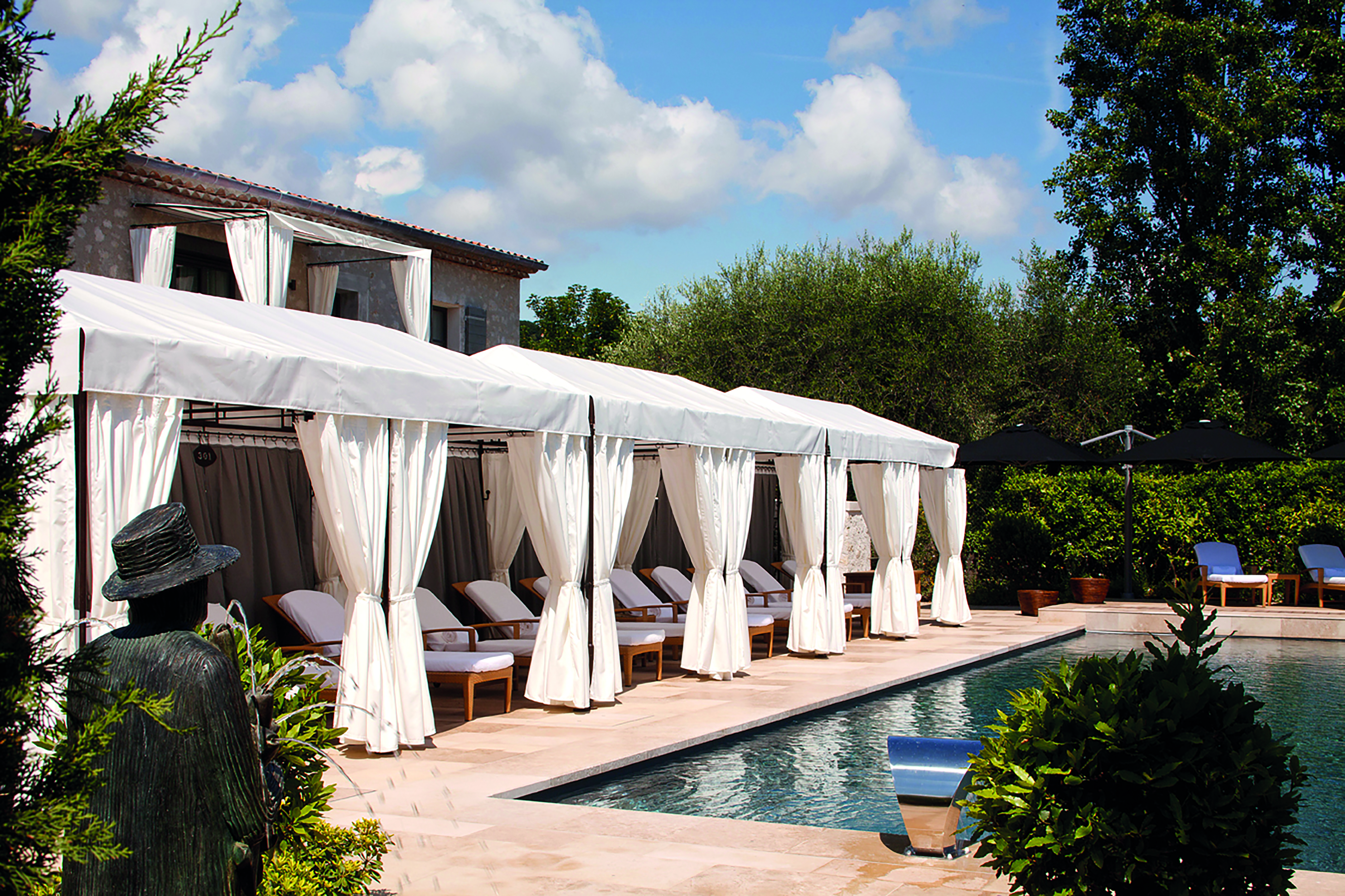 Le Mas de Pierre Cote d'Azur outdoor pool with sun loungers and white cabanas