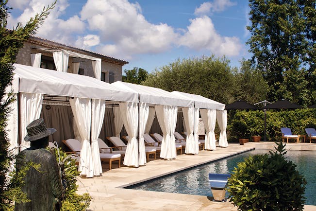 Le Mas de Pierre Cote d'Azur outdoor pool with sun loungers and white cabanas
