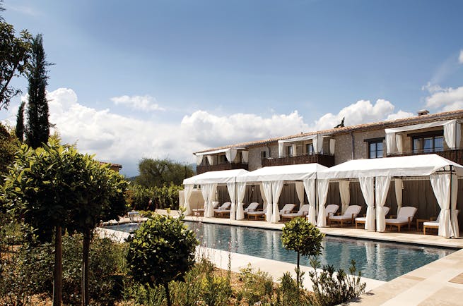 Le Mas de Pierre Cote d'Azur swimming pool outdoor sun loungers with white cabanas