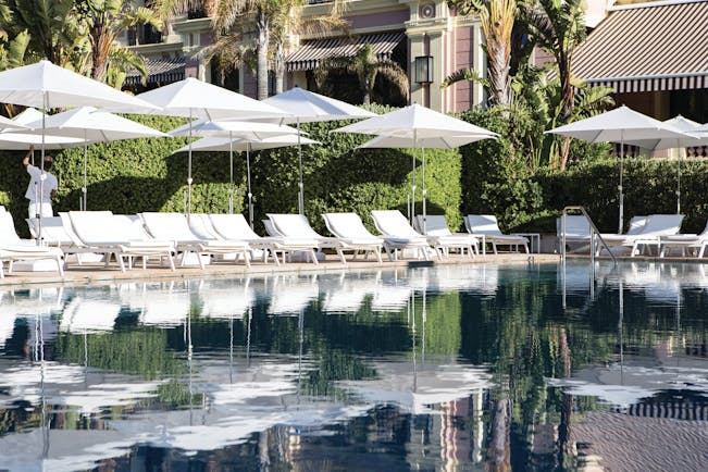 Royal Riviera Cote d'Azur exterior pool with sun loungers and umbrellas