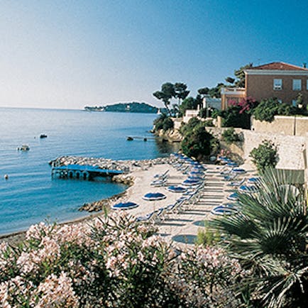 Royal Riviera Cote d'Azur private beach area with sun loungers and umbrellas