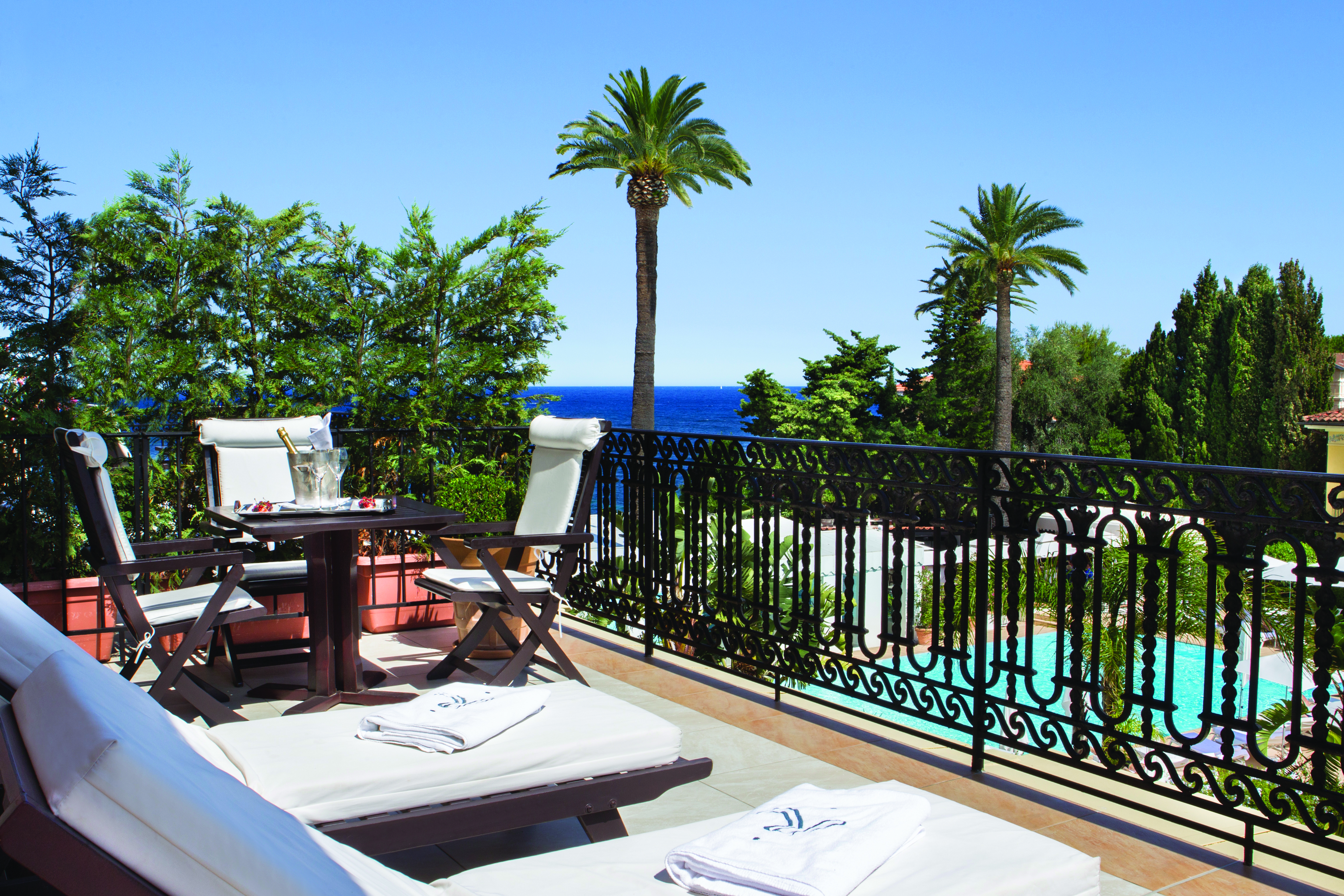 Royal Riviera Cote d'Azur suite balcony wrought iron fence sun loungers table and chairs