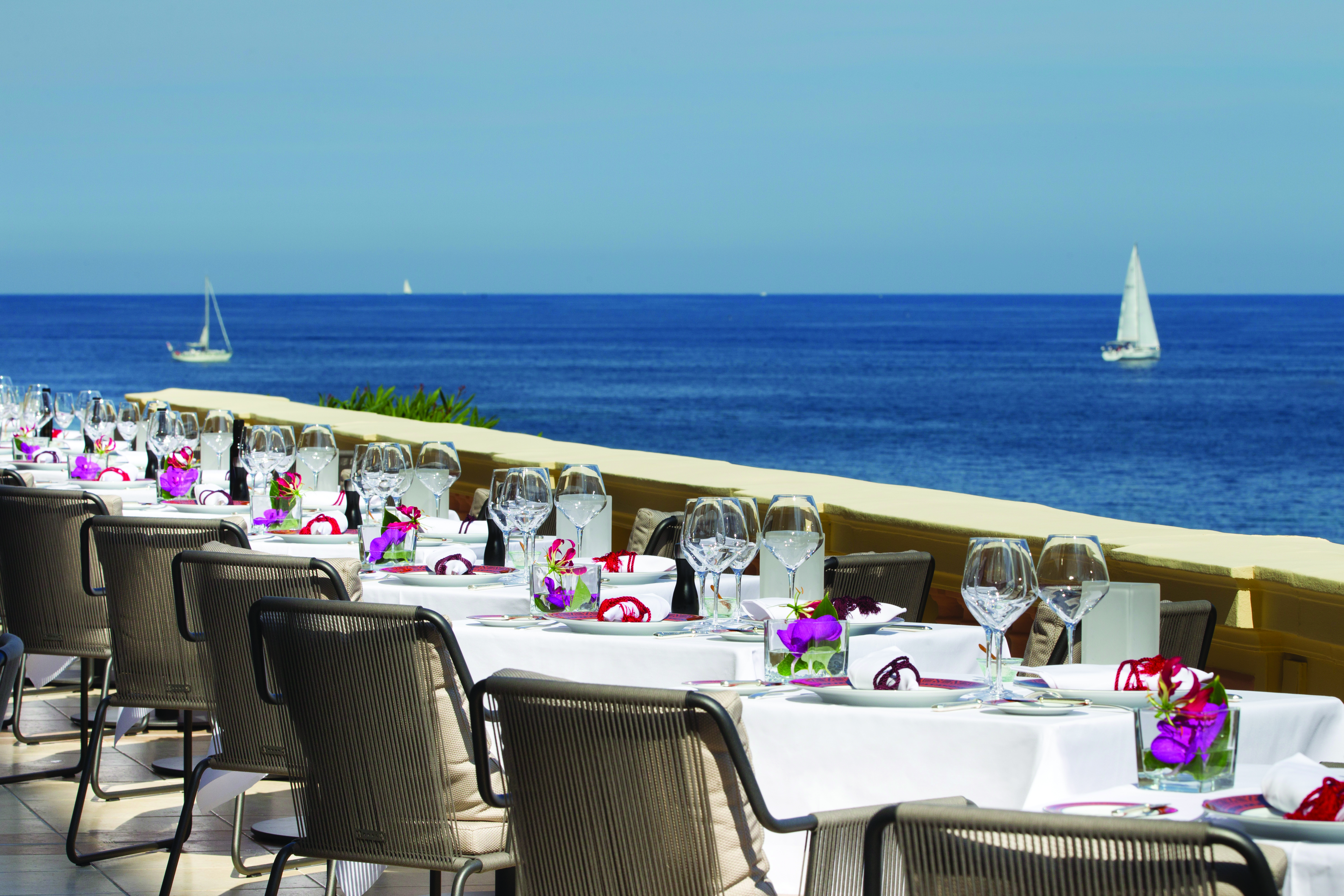 Royal Riviera Cote d'Azur sea view terrace tables with wine glasses