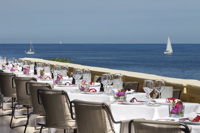 Royal Riviera Cote d'Azur sea view terrace tables with wine glasses