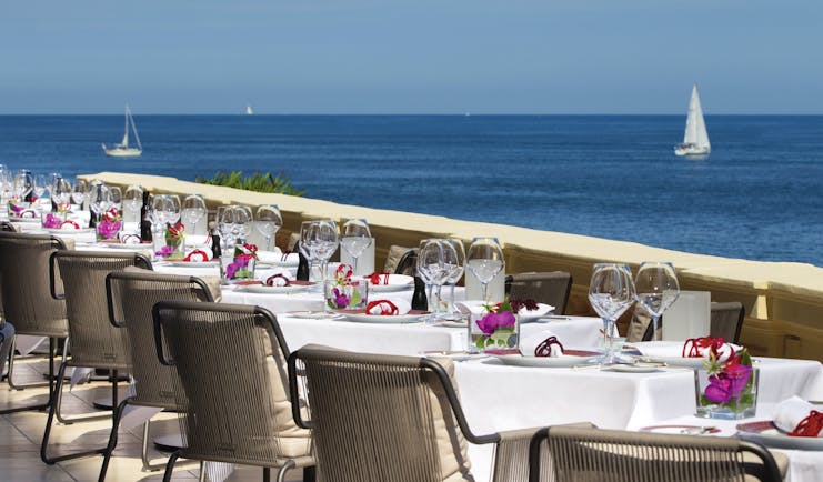 Royal Riviera Cote d'Azur sea view terrace tables with wine glasses