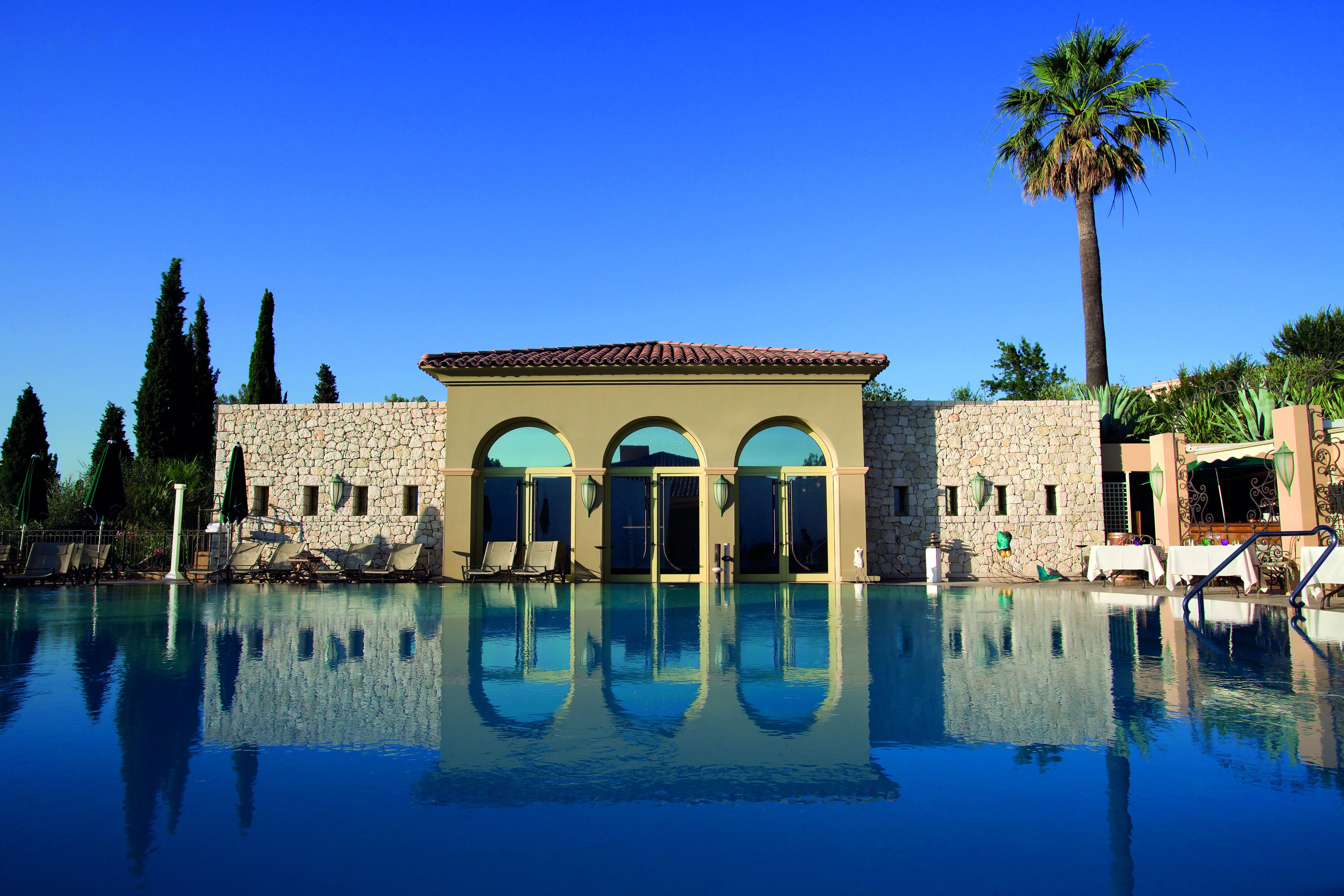 Le Mas Candille Cote d'Azur outdoor swimming pool sun loungers