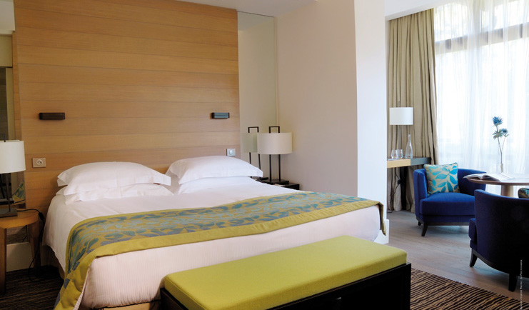 Hotel Ermitage Alps bedroom with seating area 