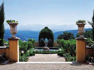 Hotel Ermitage Alps pond building viewed from ornamental pond