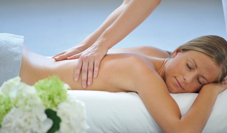 Hotel Royal Alps spa woman receiving a massage