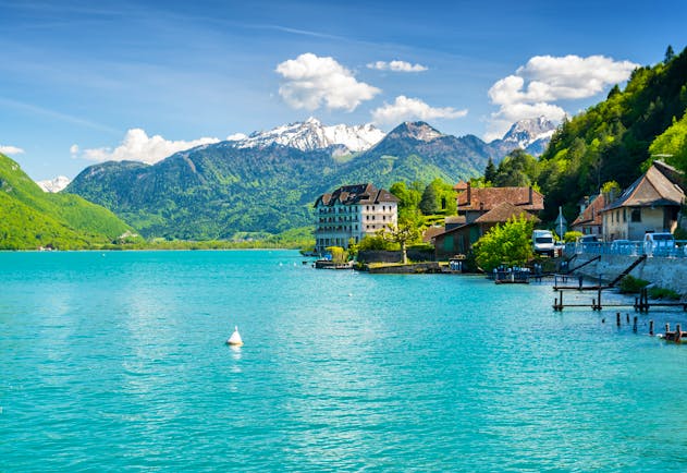 Green blue lake and mountains behind in the french alps