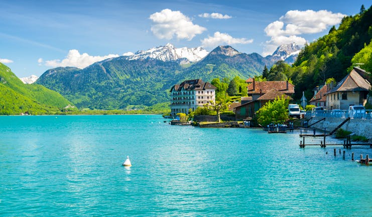 Green blue lake and mountains behind in the french alps