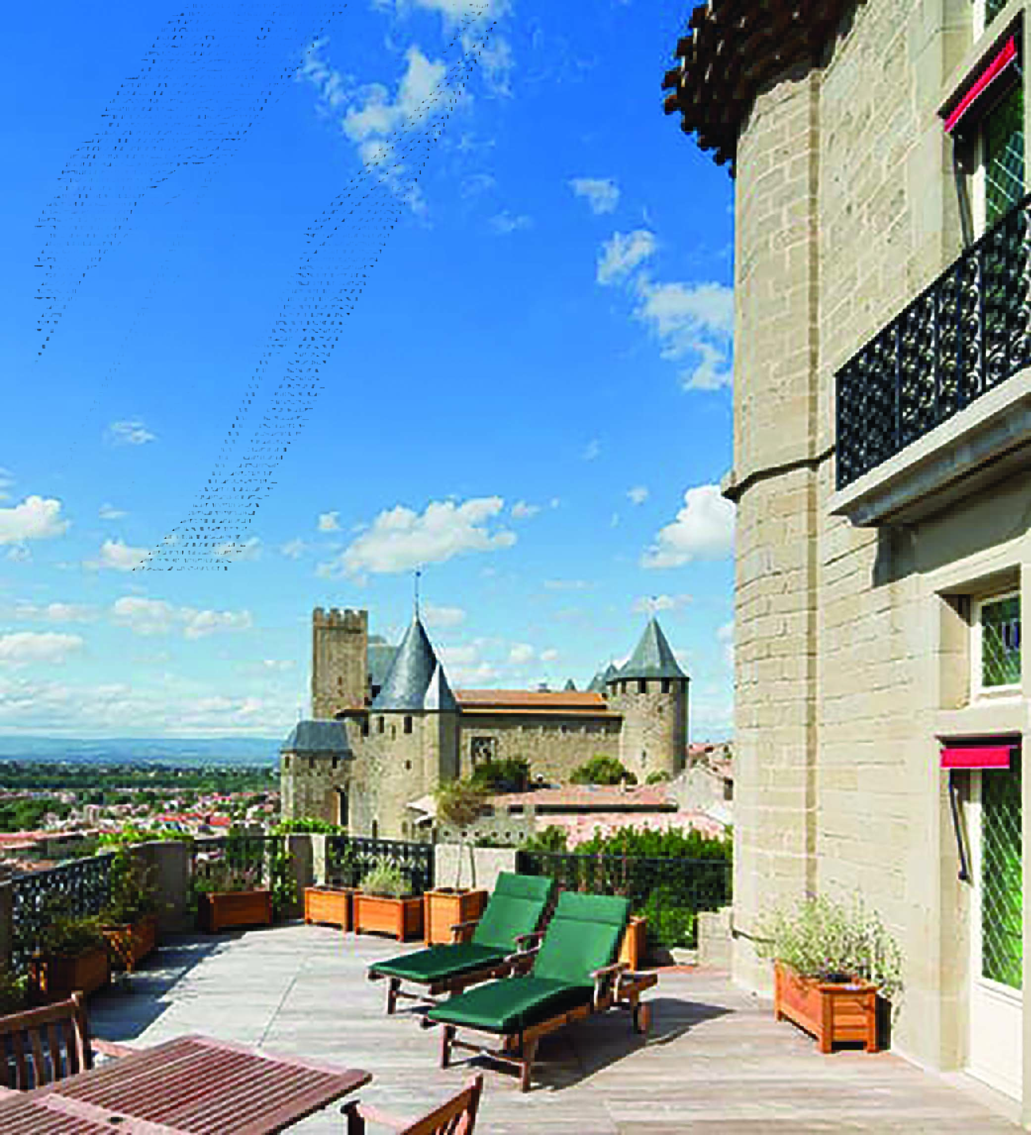 Hotel de la Cite Carcassonne Languedoc Roussillon terrace sun loungers overlooked by a chateau
