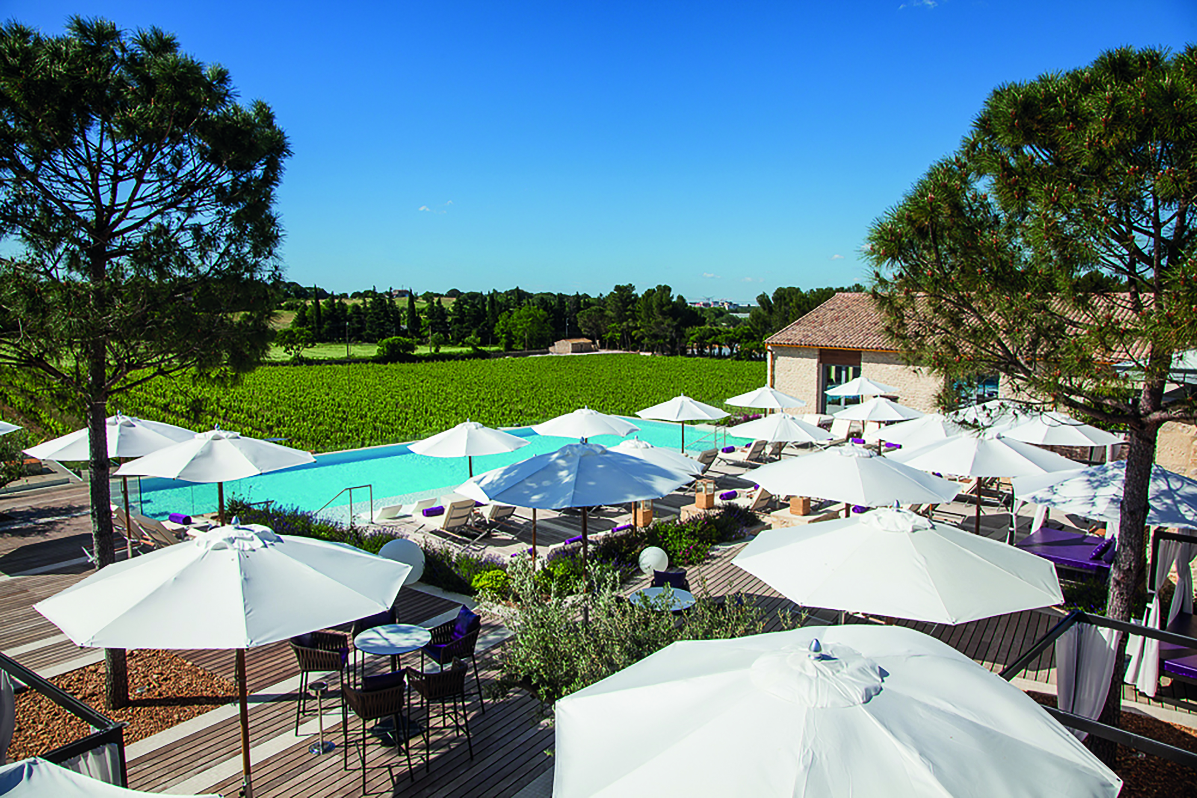 Le Domaine de Verchant Languedoc Roussillon outdoor pool aerial view umbrellas