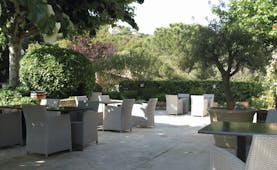 Relais des Chartreuses Languedoc Roussillon outdoor terrace area surrounded by trees