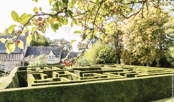 Chateau Noirieux Loire Valley garden maze hedge front of a stone building