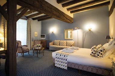 Chateau Noirieux Loire Valley superior king bedroom blue walls and exposed wooden beams