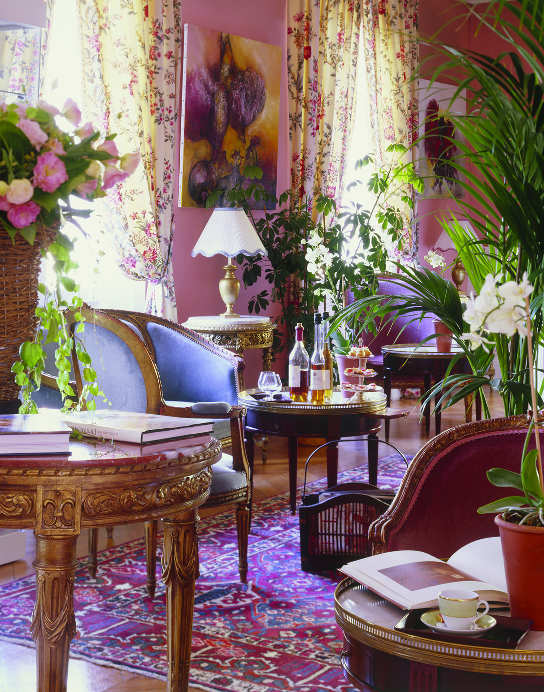 Lounge area with pink and floral patterned colour scheme