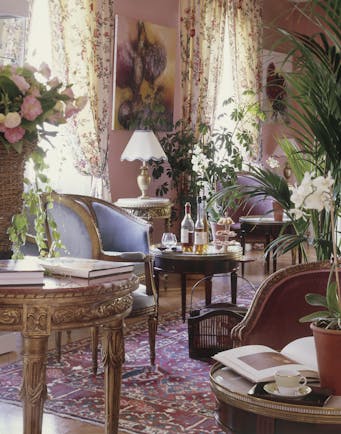 Lounge area with pink and floral patterned colour scheme
