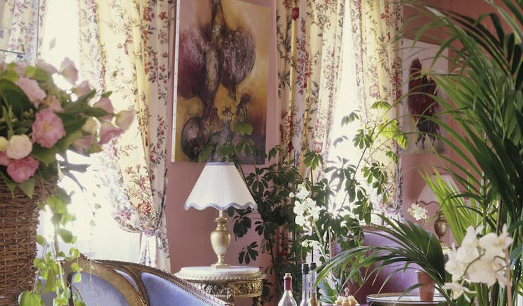 Lounge area with pink and floral patterned colour scheme