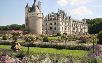 Chateau of Chenonceau with tower and turrets and formal gardens