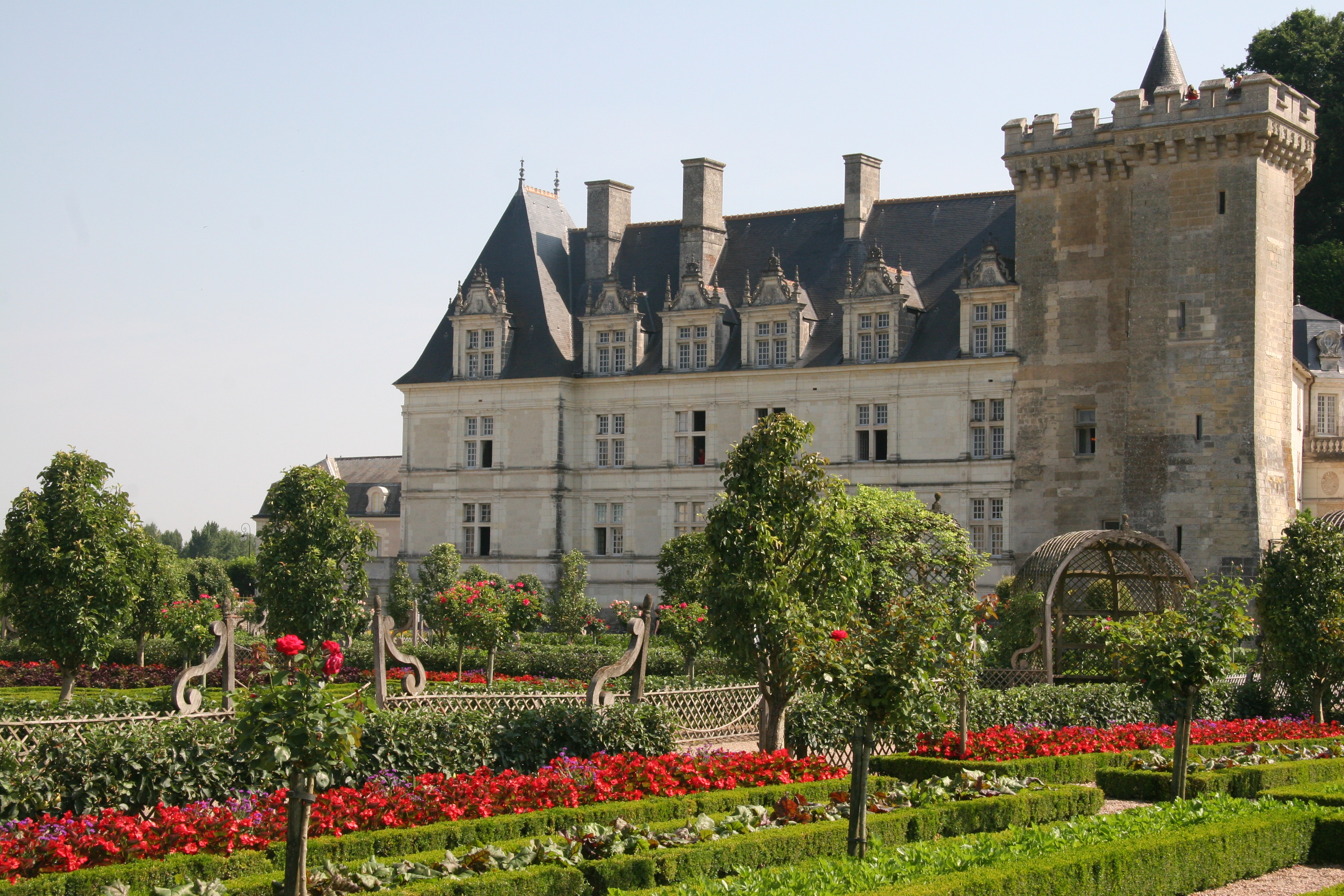 Renaissance chateau with red flowers in bed at Villandy