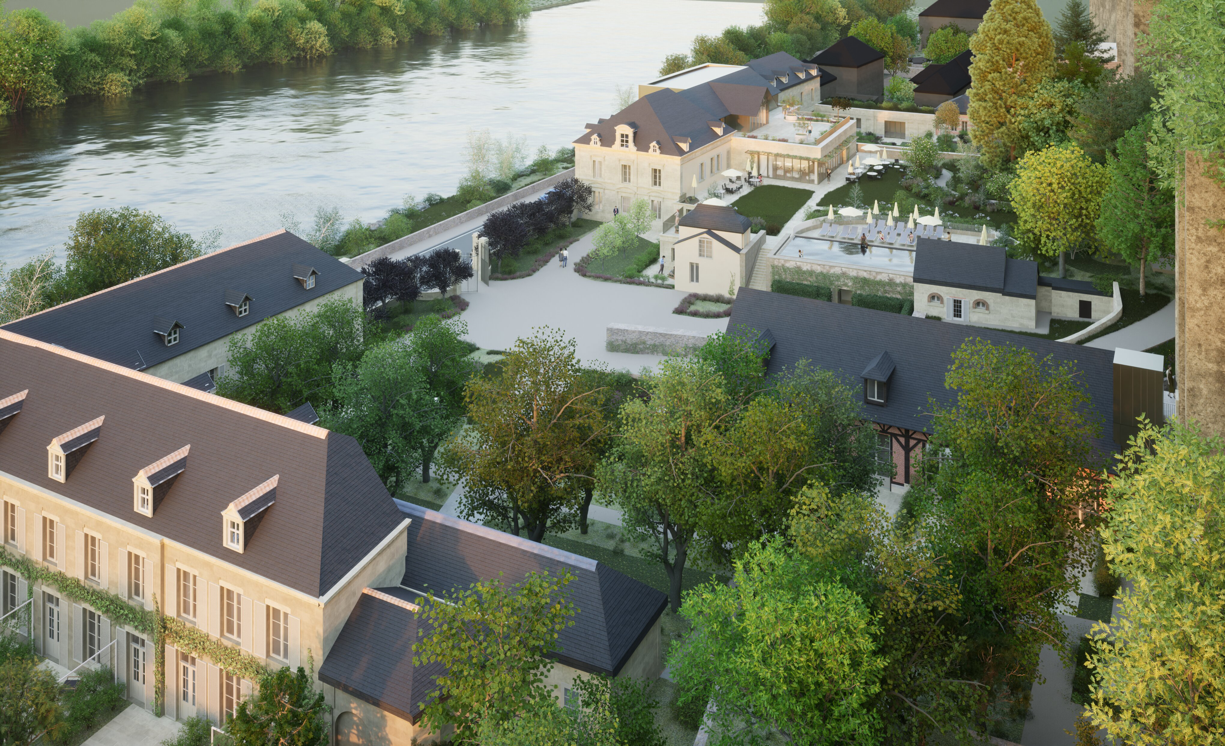 Relais d'Amboise aerial view, showing riverside location, central courtyards, and the many stone hotel buildings, separated by pathways and trees
