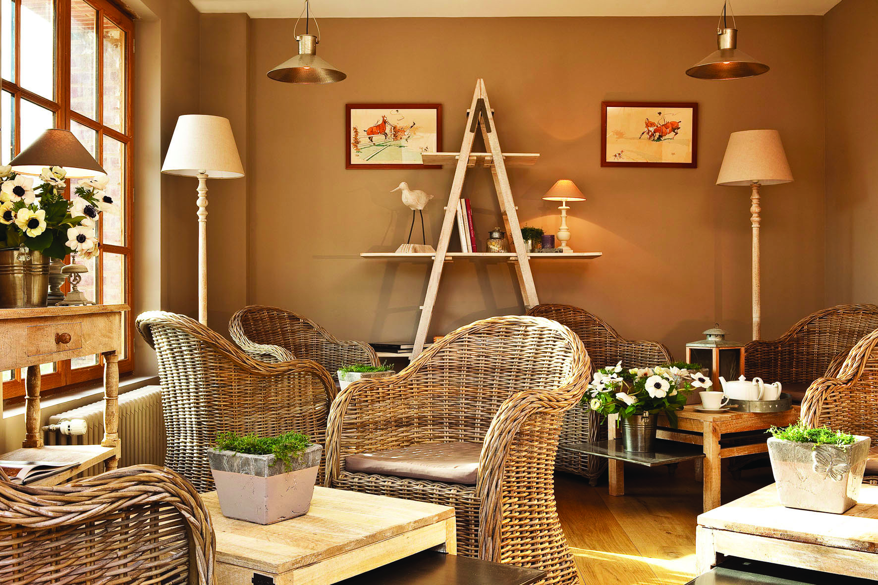 Auberge de la Source Normandy lounge area with brown wicker chairs