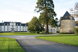 Chateau de Sully ground, hotel buildings, driveway, lawns, trees