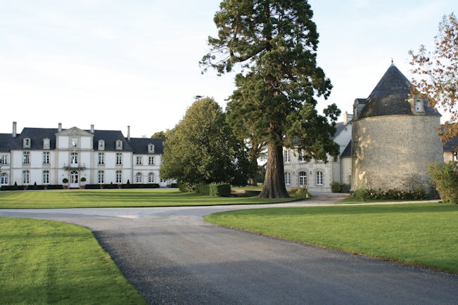 Chateau de Sully ground, hotel buildings, driveway, lawns, trees