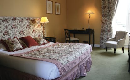 Chateau de Sully guestroom, double bed, armchair, grand traditional decor