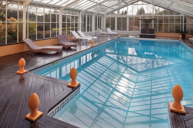 Chateau de Sully pool, indoor pool, glass walls and ceiling, sun loungers