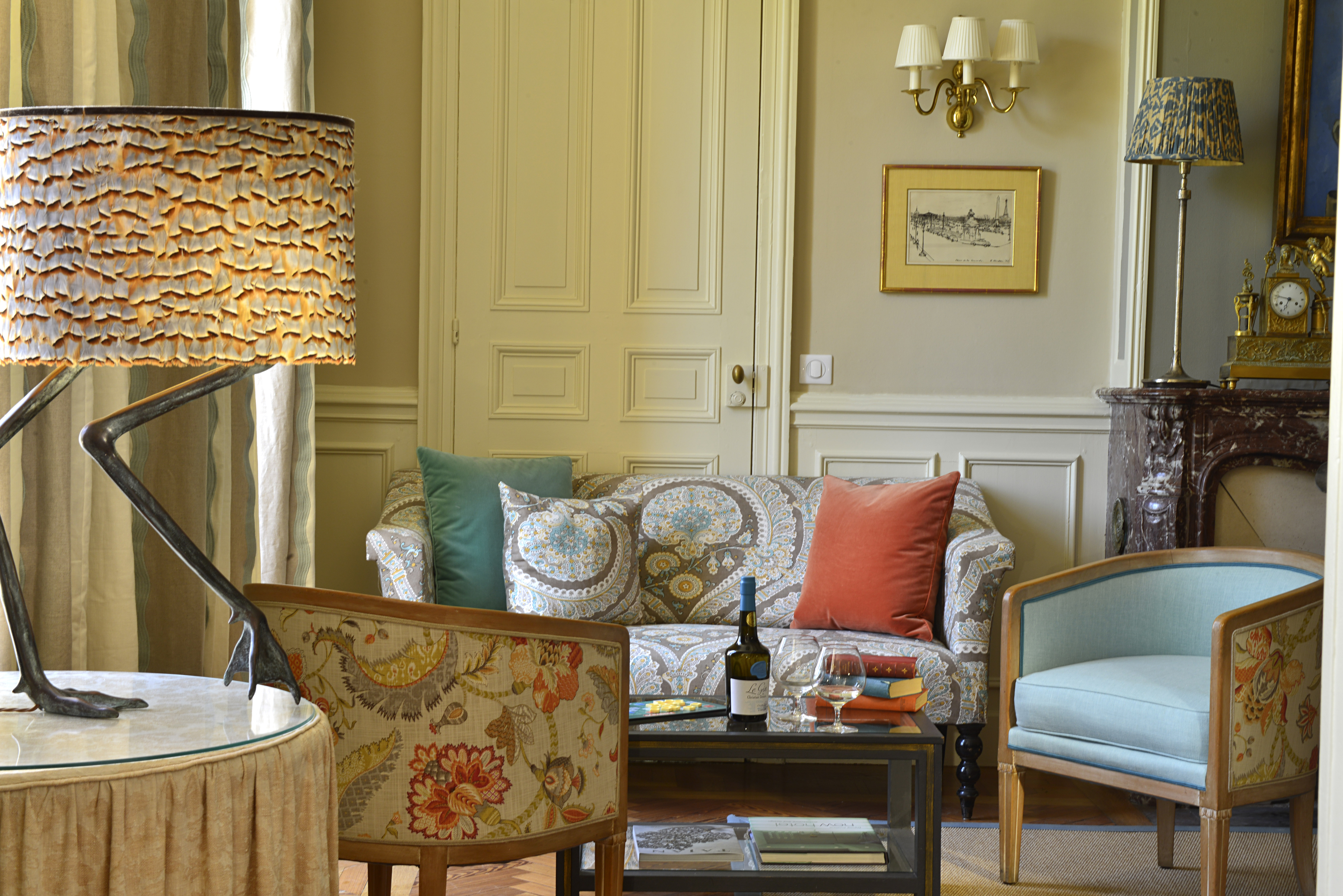 Lounge area with cushioned arm chairs, a fireplace and coffee table