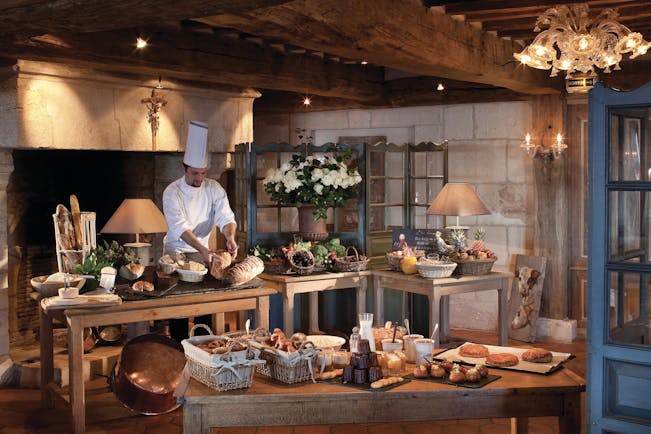 La Ferme Saint Simeon Normandy buffet breakfast bench two large tables with bread and pastries