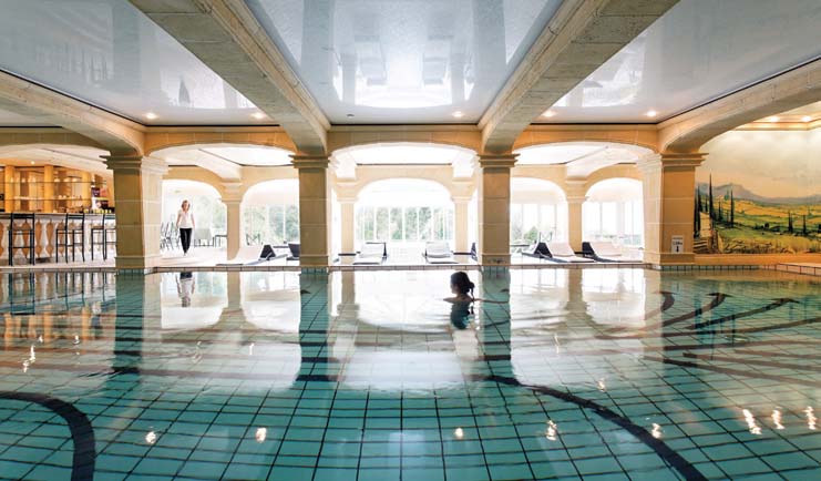 La Ferme Saint Simeon Normandy indoor pool spa woman swimming