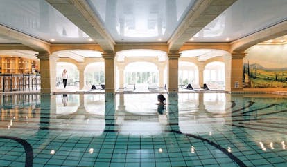 La Ferme Saint Simeon Normandy indoor pool spa woman swimming