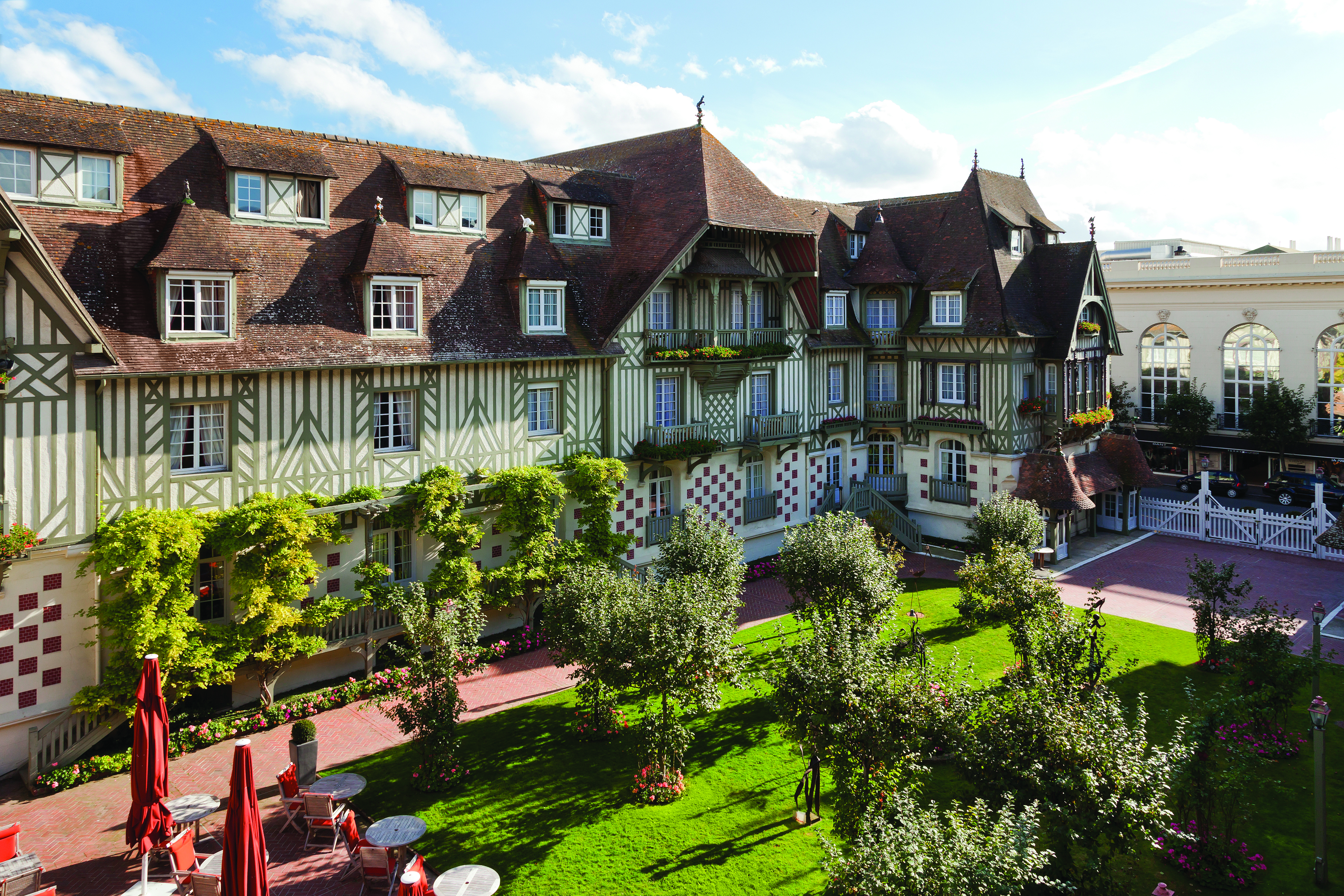 Hotel Normandy Barriere Normandy courtyard aerial shot of building foliage and trees