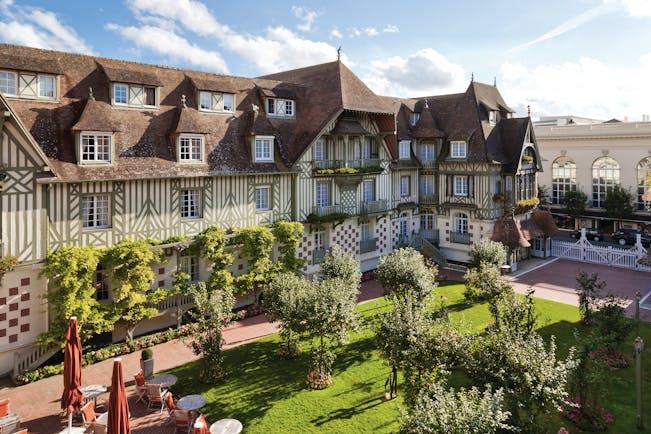 Hotel Normandy Barriere Normandy courtyard aerial shot of building foliage and trees