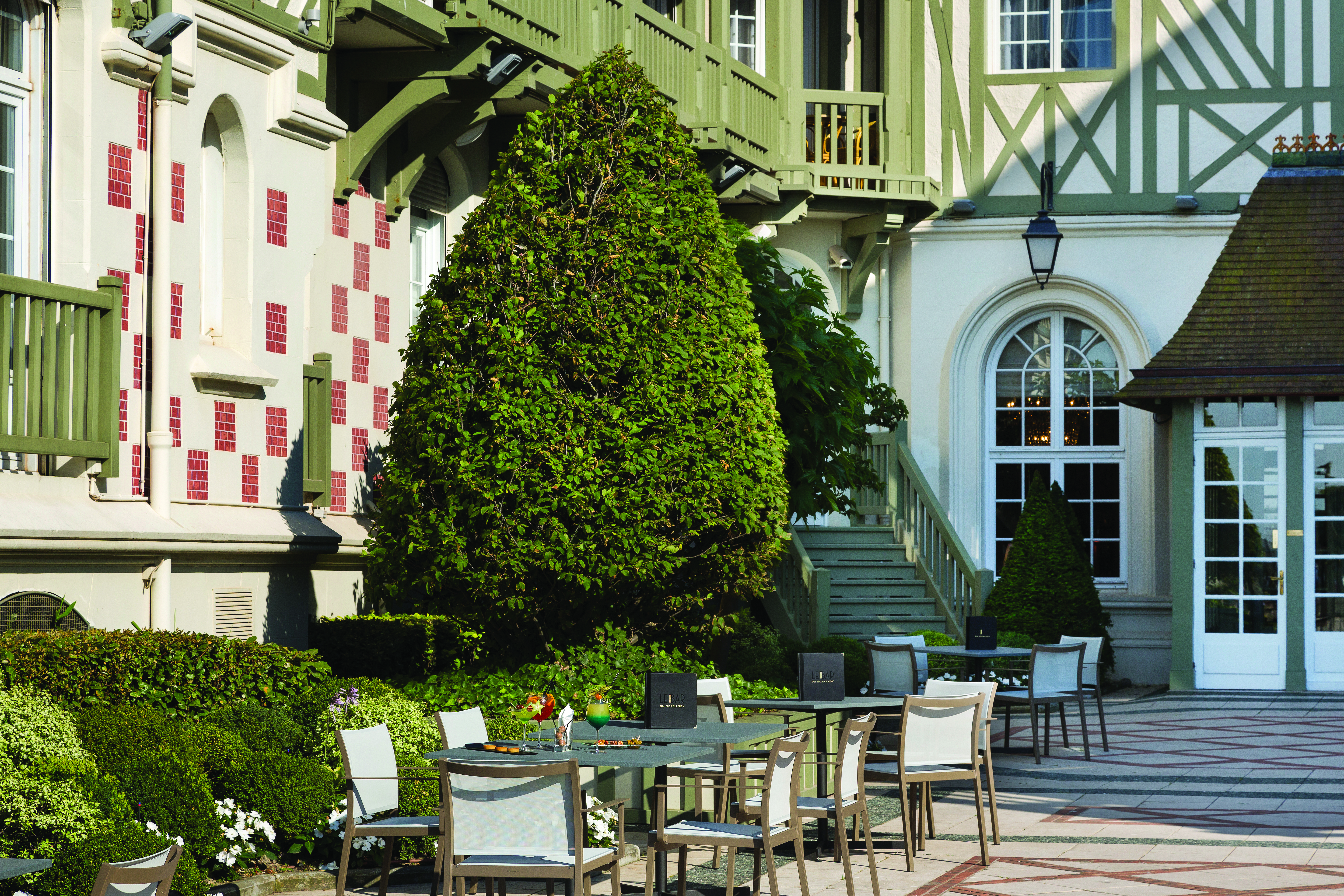 Outdoor terrace patio with seating areas set out 