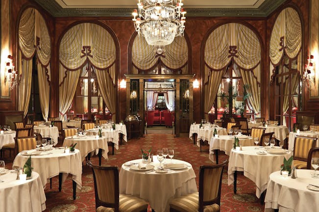 Hotel Royal Barriere restaurant, traditional decor, tables chairs, drapery, chandelier