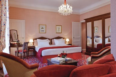 Hotel Royal Barriere terrace room, double bed, armchairs, colourful traditional decor