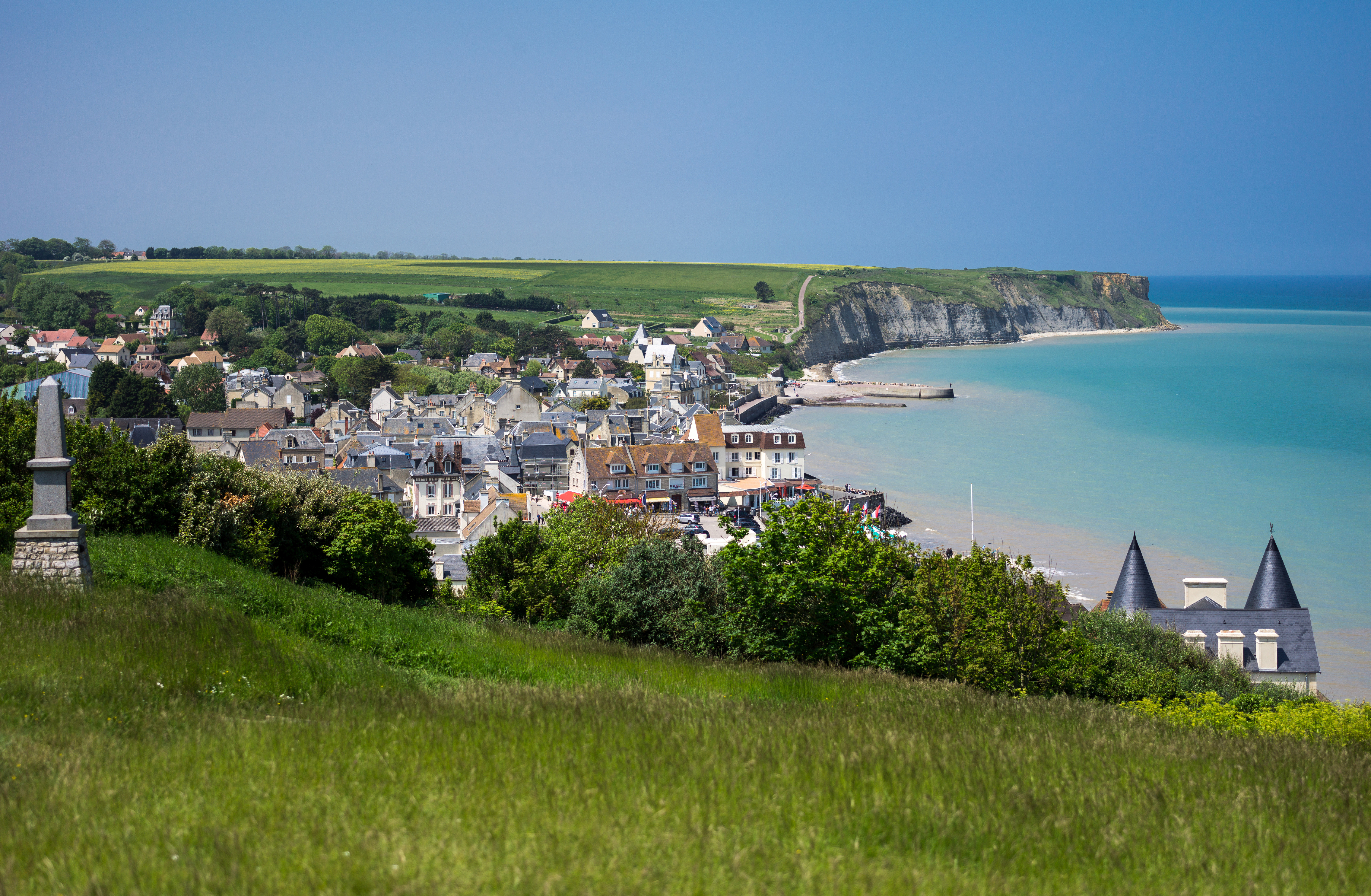 Coastal town of Arromanches with sea and harbour in Normandy