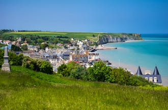 Coastal town of Arromanches with sea and harbour in Normandy