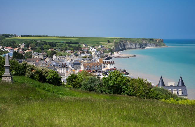 Coastal town of Arromanches with sea and harbour in Normandy
