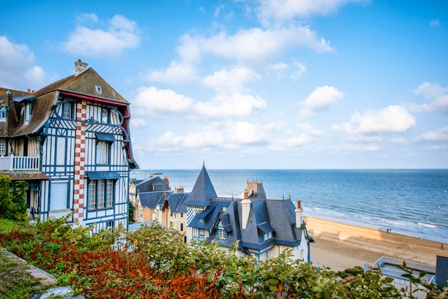 Chateau-style houses with turrets in Normandy coastal town of Trouville