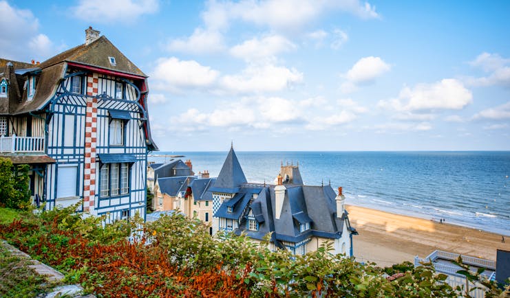 Chateau-style houses with turrets in Normandy coastal town of Trouville