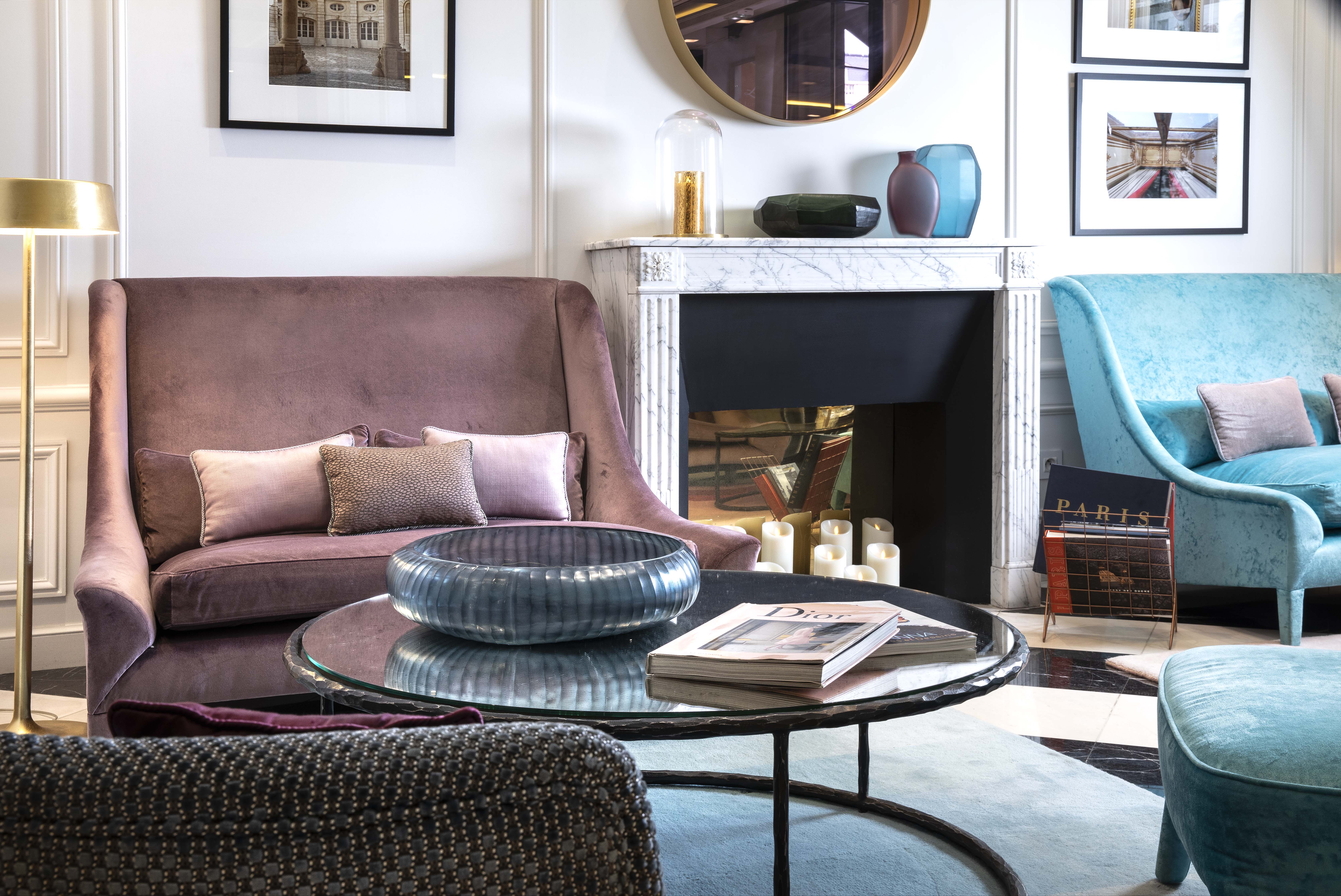 Bourgogne Et Montana lobby, velvet chairsm fireplace, elegant decor