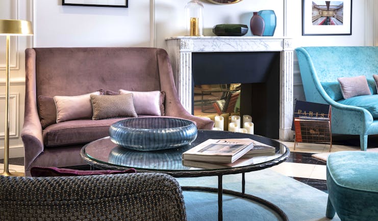 Bourgogne Et Montana lobby, velvet chairsm fireplace, elegant decor